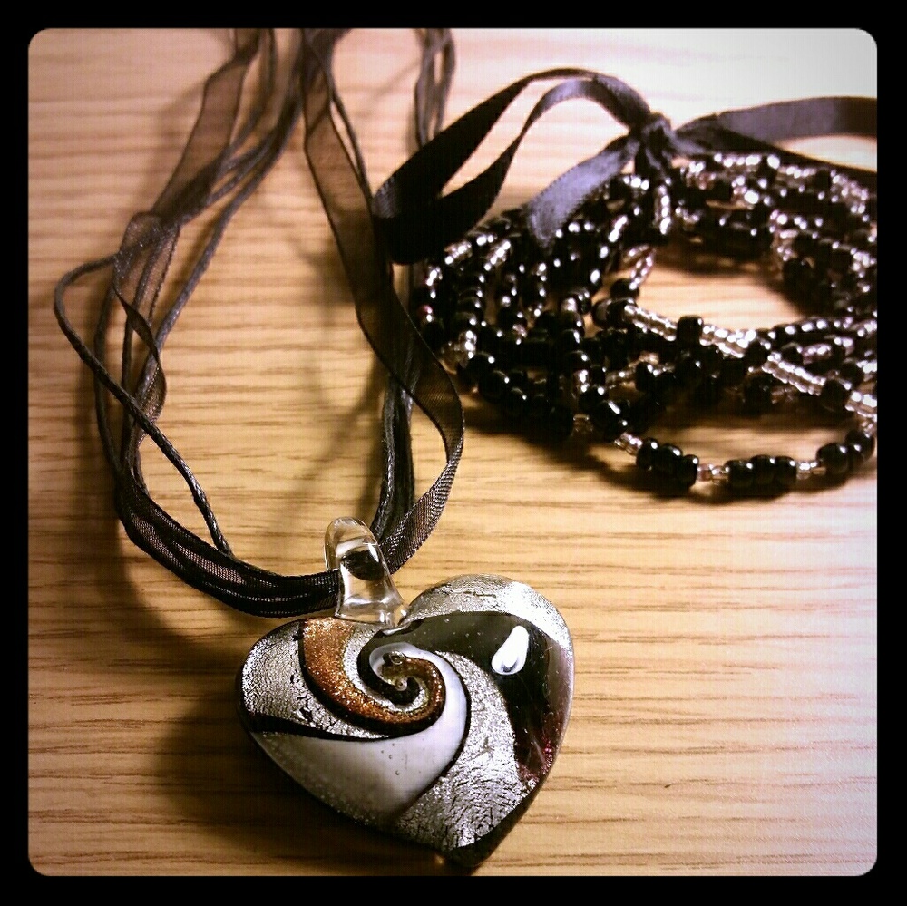 Black bracelet and decorated glass pendant