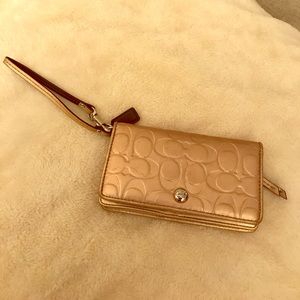 Rose Gold coach wristlet wallet
