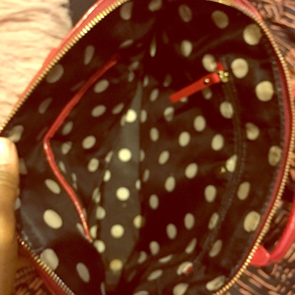 Red Kate Spade bag with removable strap