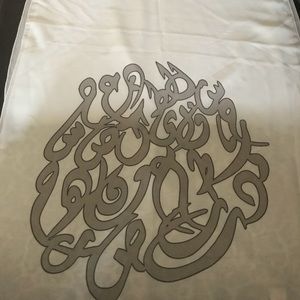 White scarf with writing Arabic