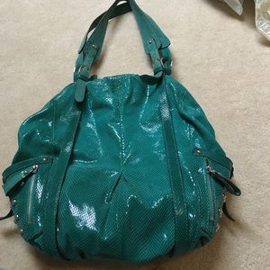 Turquoise HYPE leather shiny bag with metal studs