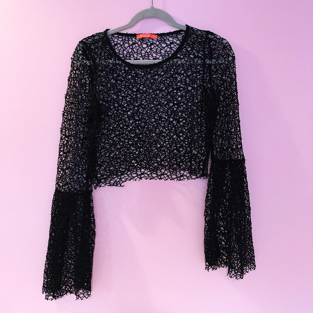Unique see through top with bell bottom sleeves!