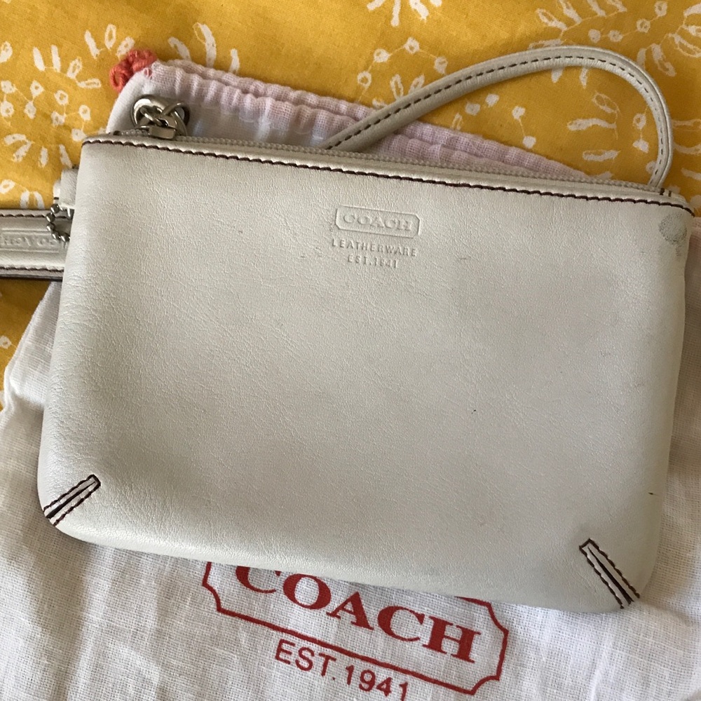 Small white Coach wristlet