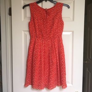 Flowy orange dress with cream polka dots