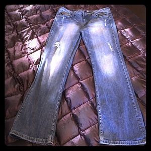 Distressed blue jeans loved and awesome fit