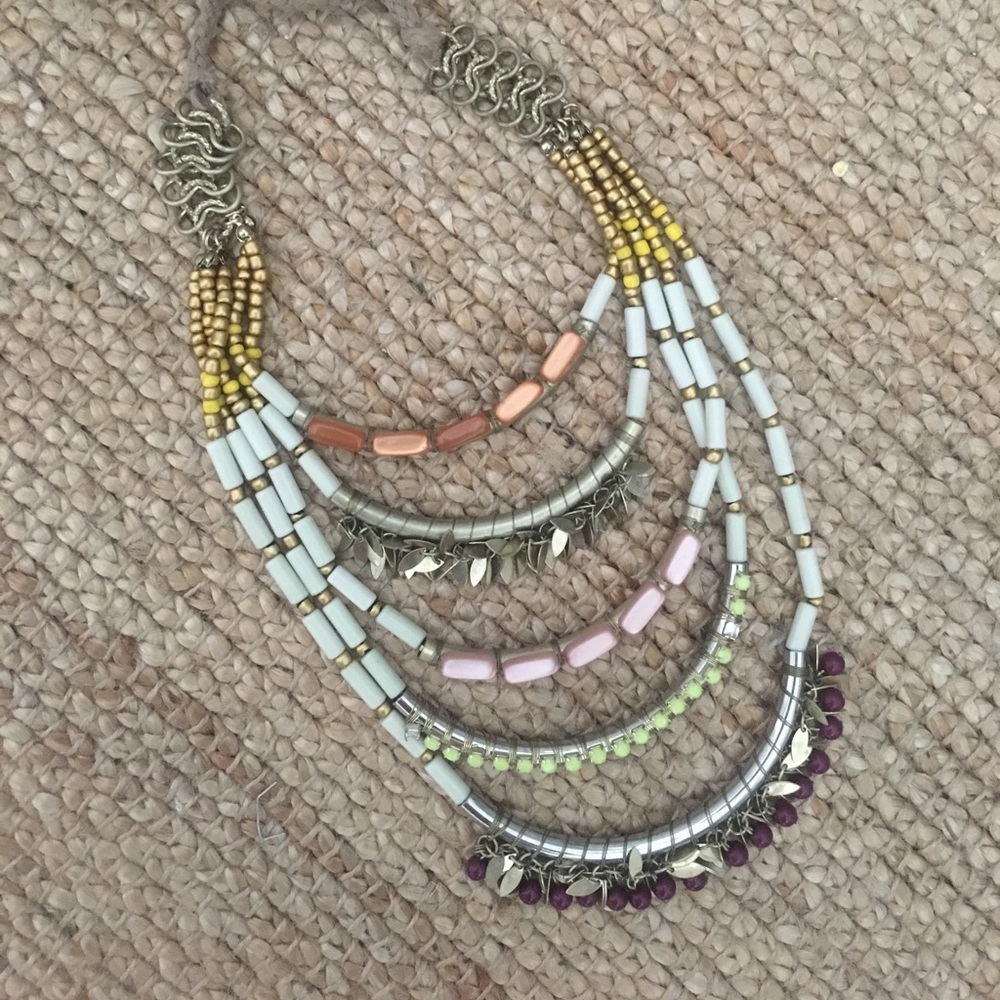 Beaded necklace with adjustable tie closure