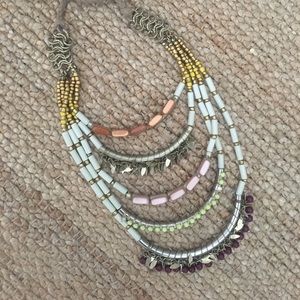 Beaded necklace with adjustable tie closure