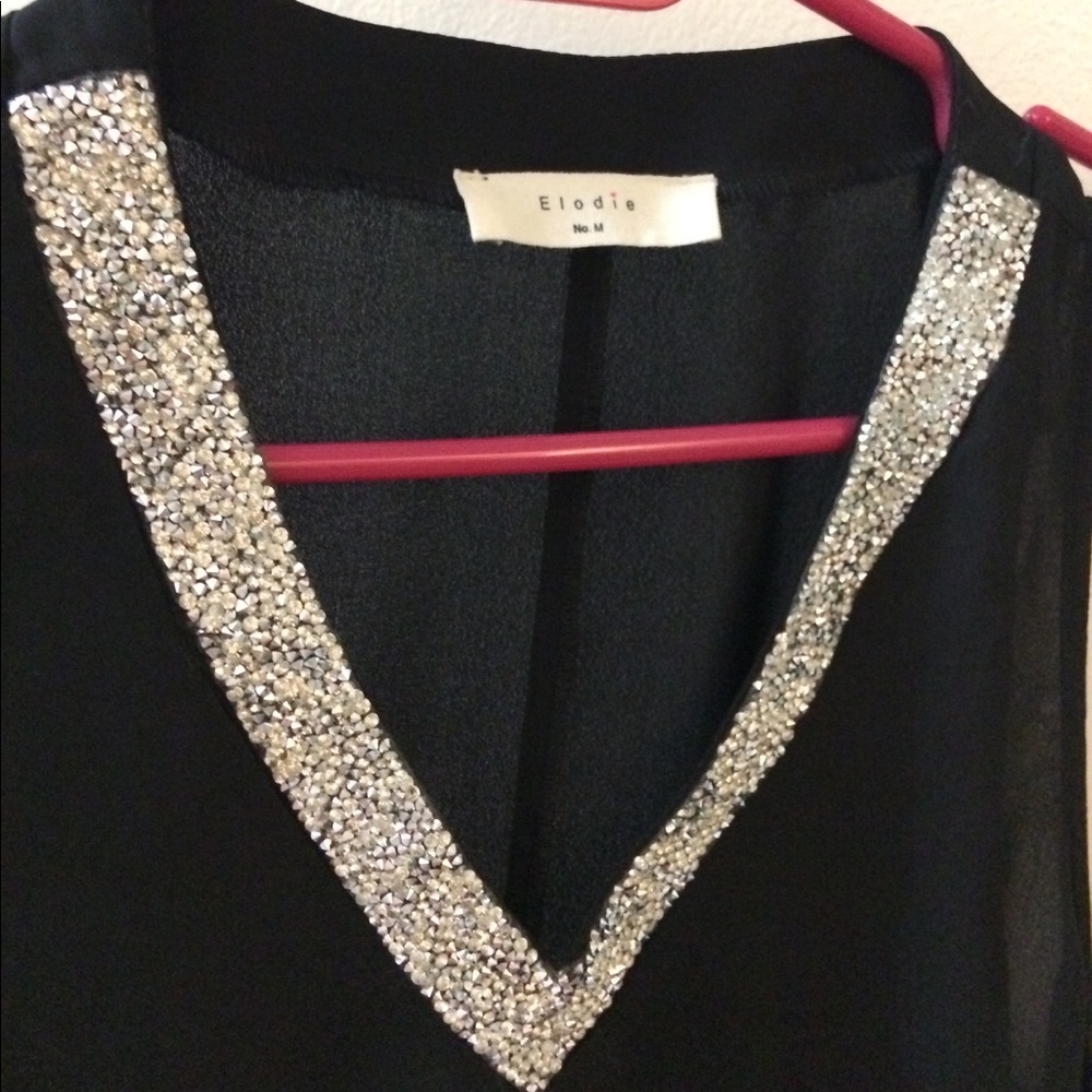 Black tank top, silver sparkle v neck.
