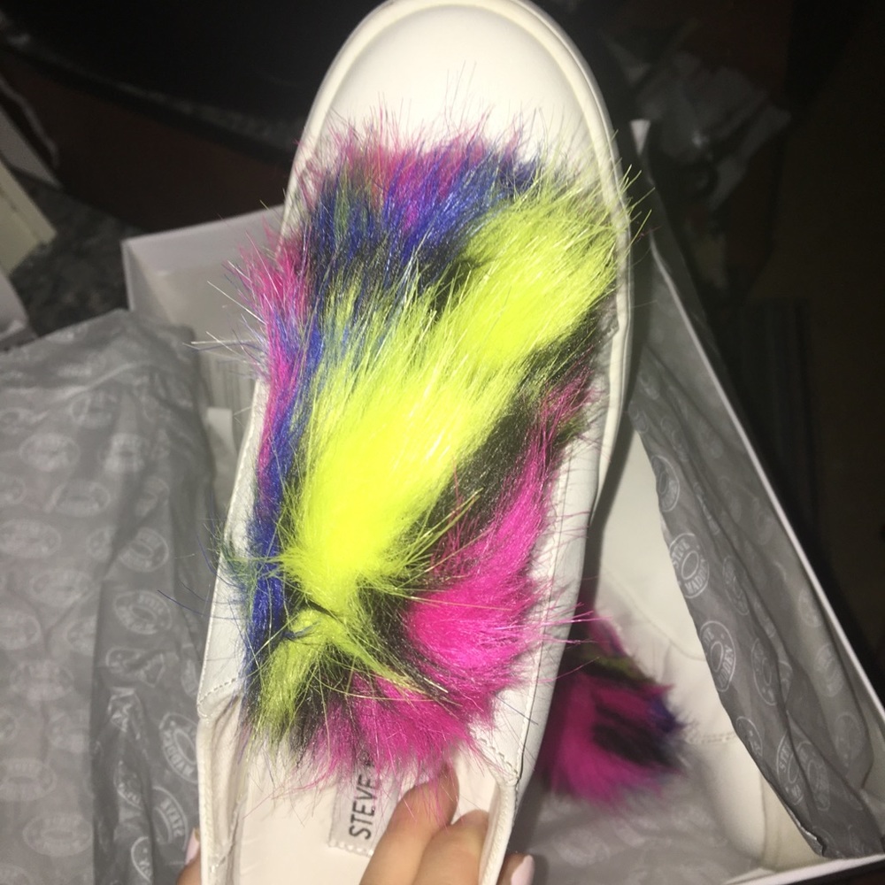 White sneakers with colorful puffball