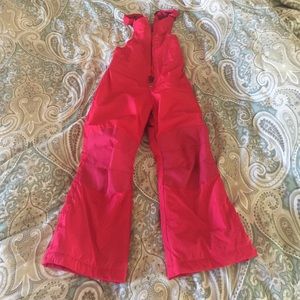 Girl’s pink snow or ski bibs.