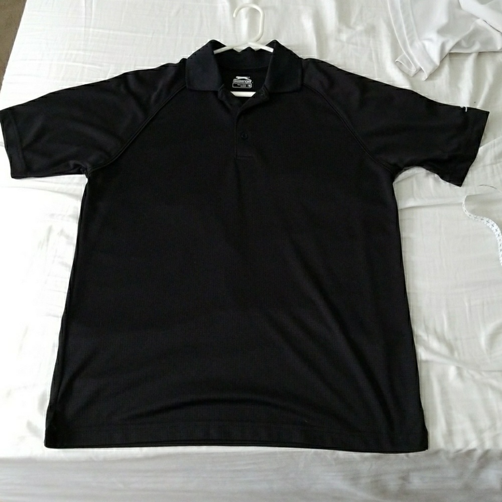 Size medium black golf polo. Worn only once!