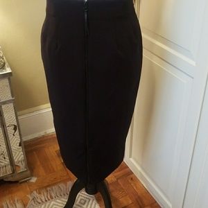 Black pencil skirt with exposed zipper.