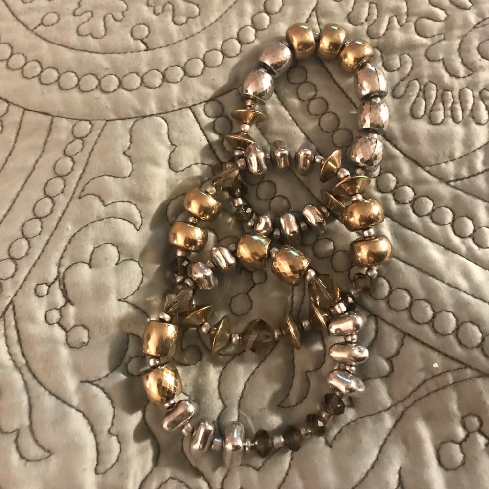 Three matching silver and gold bracelets