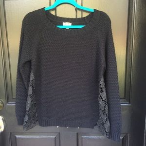 Black knit sweater with lace inlays