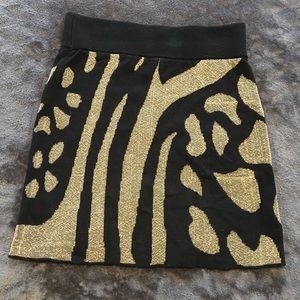 Fun black and gold miniskirt by Ecoté