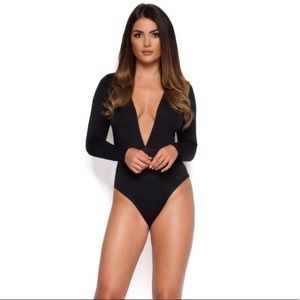 NEW NEVER WORN BLACK BODY SUIT