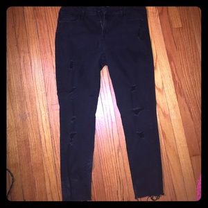 Distressed black skinny jean