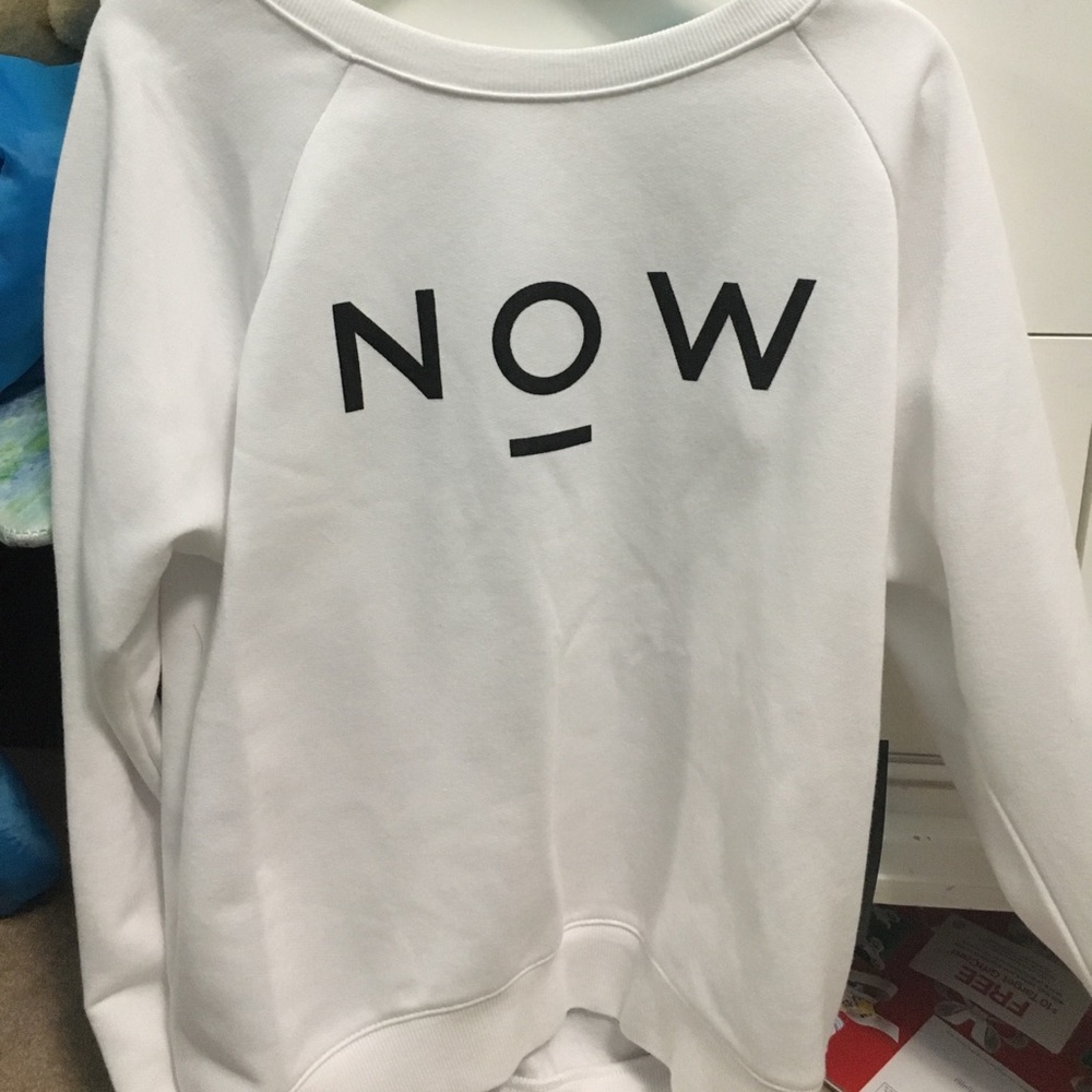 White sweatshirt that says "now a days"