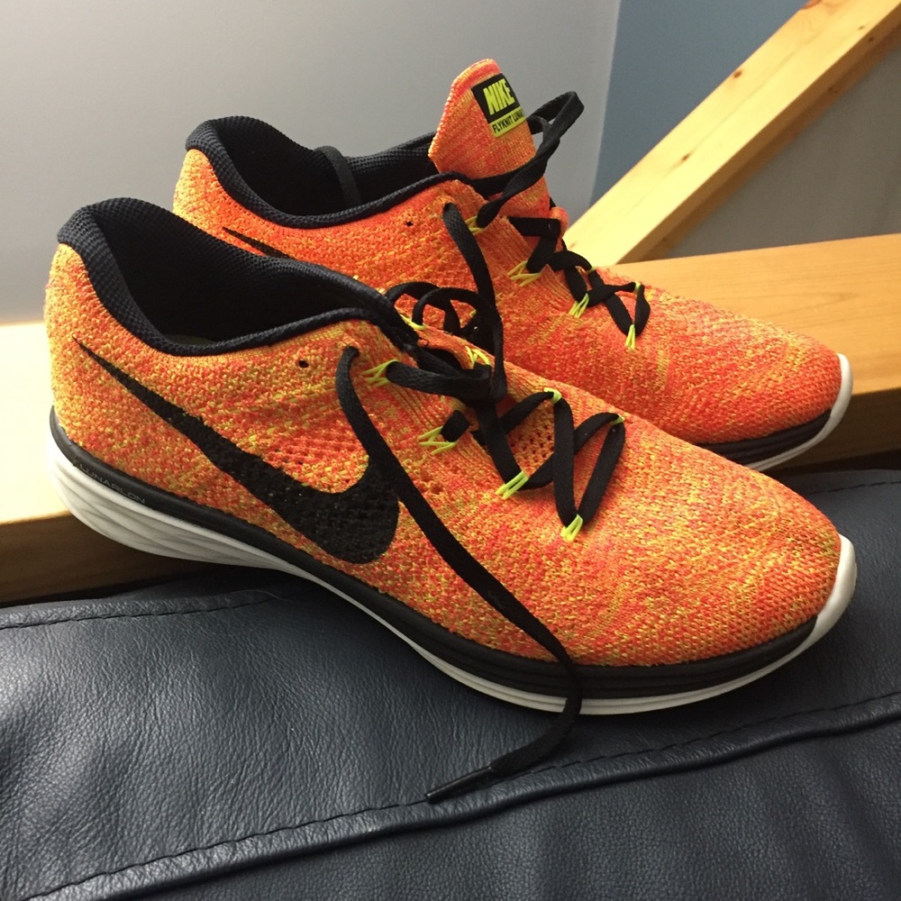 Orange and yellow Nike running shoes