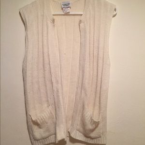 Sleeveless white sweater