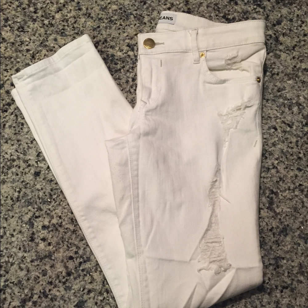 Distressed white denim jeans