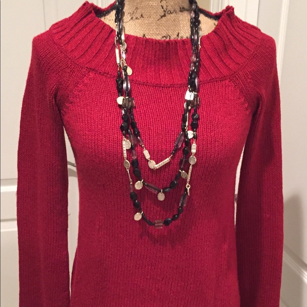 Hot red sweater dresses up any skirt or jeans