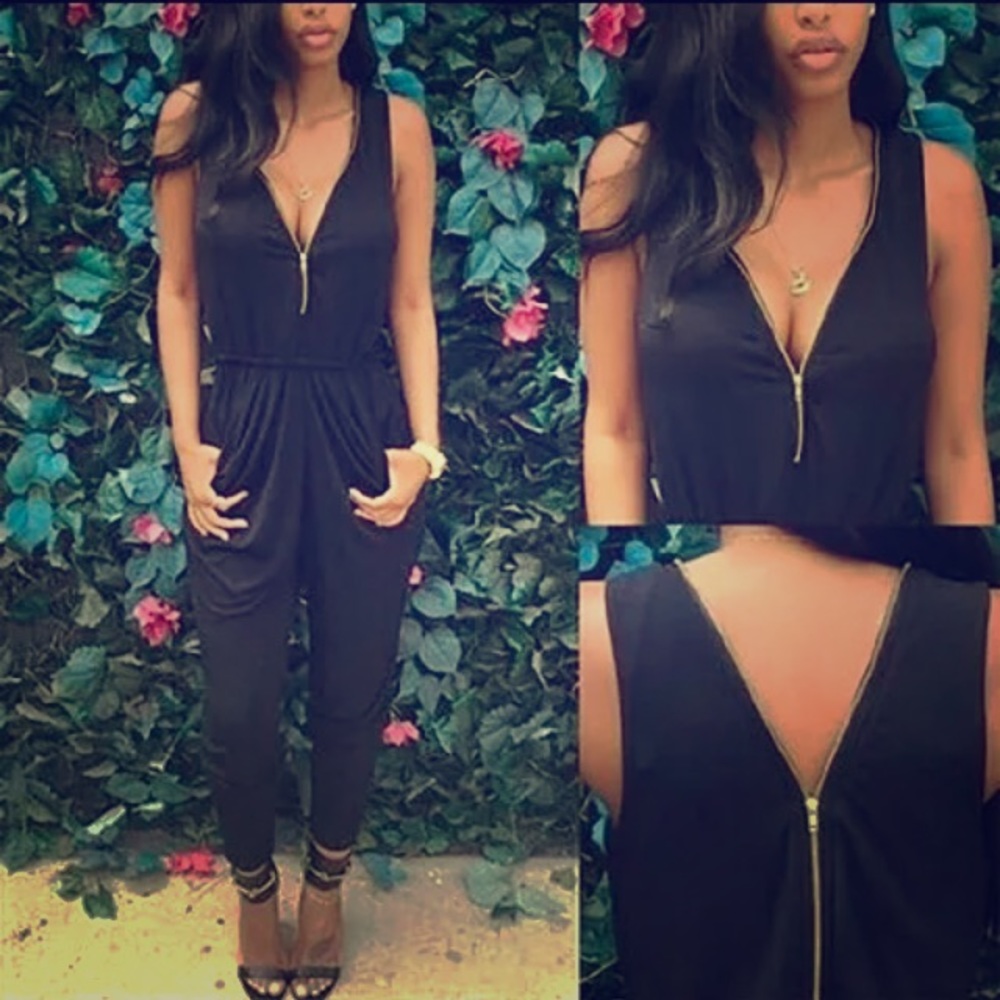 Black romper. Fits a medium