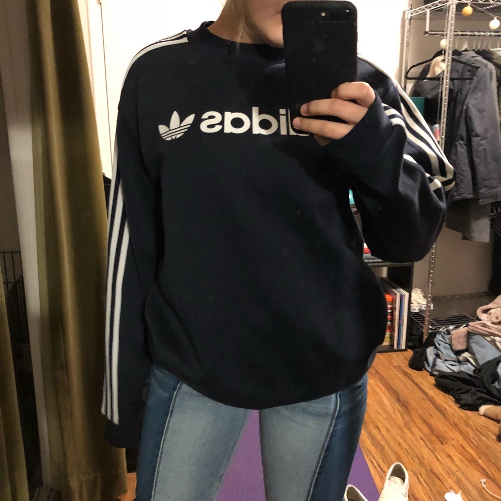 New with tags. Adidas dark blue crew neck sweater.