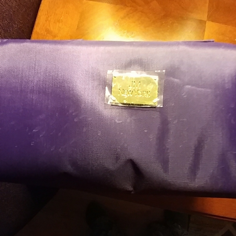 Joy Mongano. 4 pocket cosmetic/toiletries