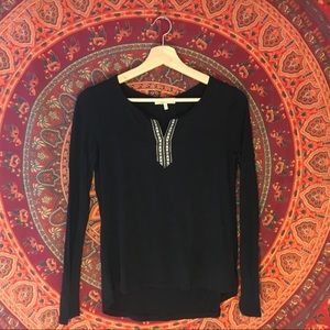 Black long sleeve shirt with v-neck pattern