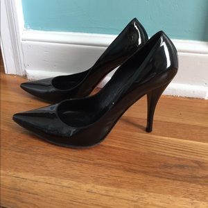 Casadei black patent pumps