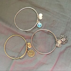 Three Alex and Ani bracelets