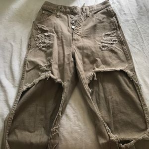 High waisted tan cut up jeans