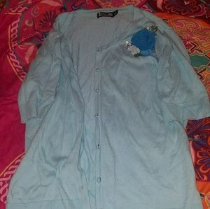 Blue cardigan with flower