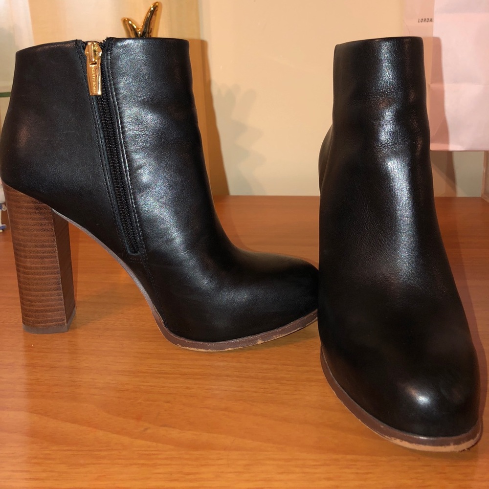 Black patent leather booties with wood block heel.