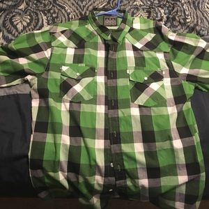Long sleeve flannel button down shirt.