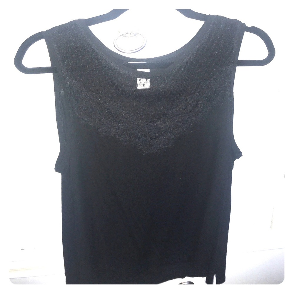 Black lace sleeveless shirt.