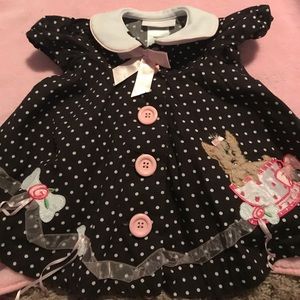 Brown polka dot baby girl’s dress
