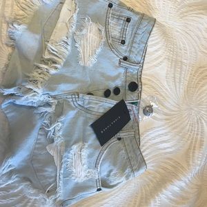 medium/high waisted light wash shorts.