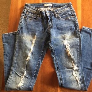Tattered skinny jeans. Size 1. Inseam 31”.