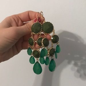 Green Dangling statement earrings.