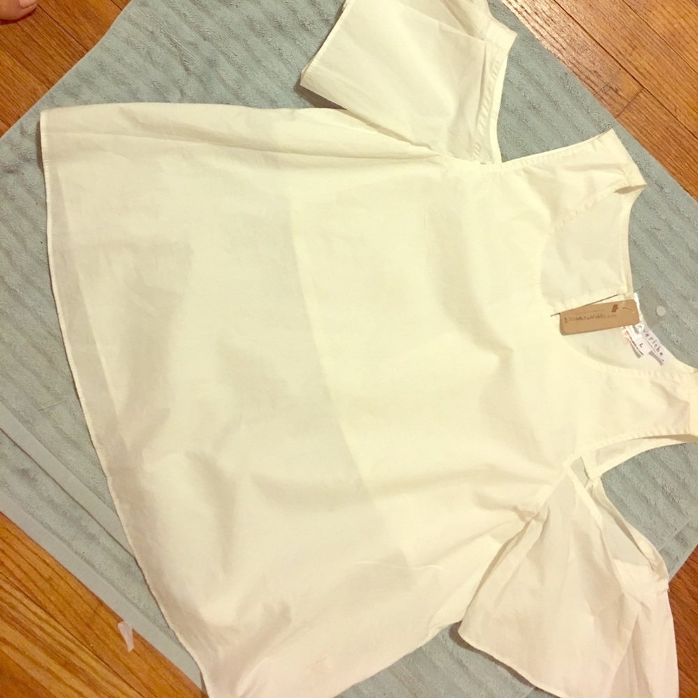 White shoulder cut off top