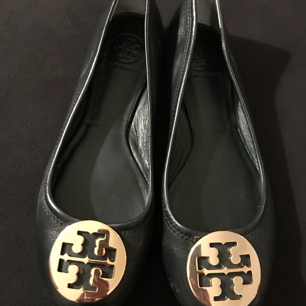 Tory Burch leather flats w/ classic gold logo.