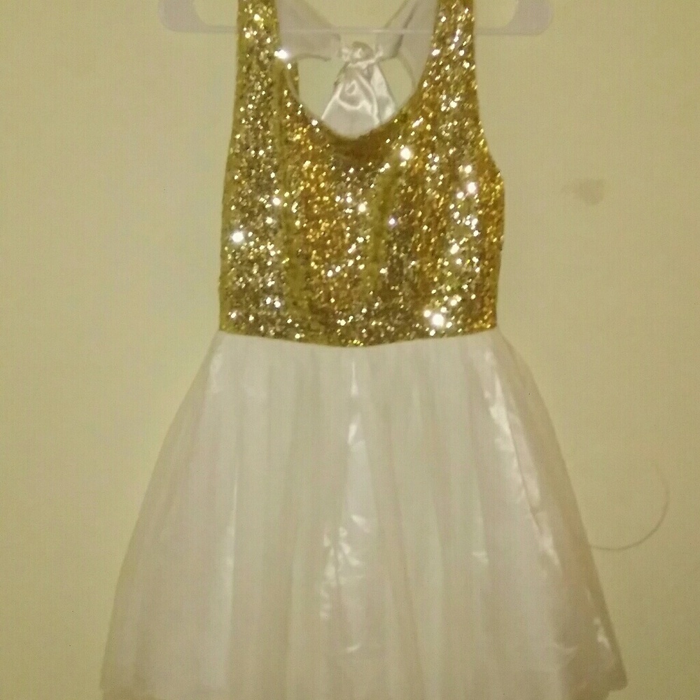 Fun gold sequins dress with white tutu like skirt.