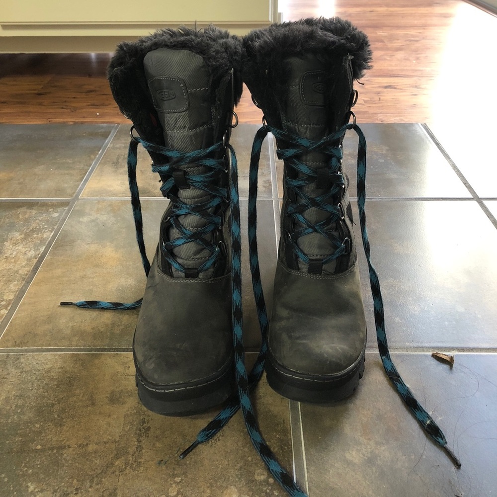 Black and blue Keen winter boots