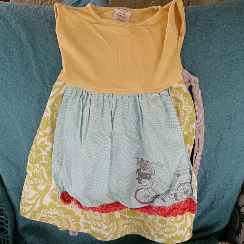 Girl's whimsical apron dress