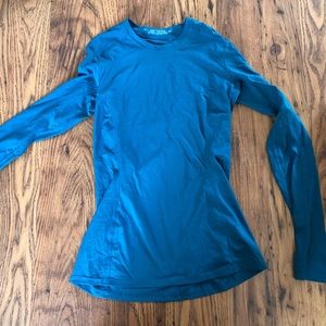 Blue Arc’teryx long-sleeved shirt.