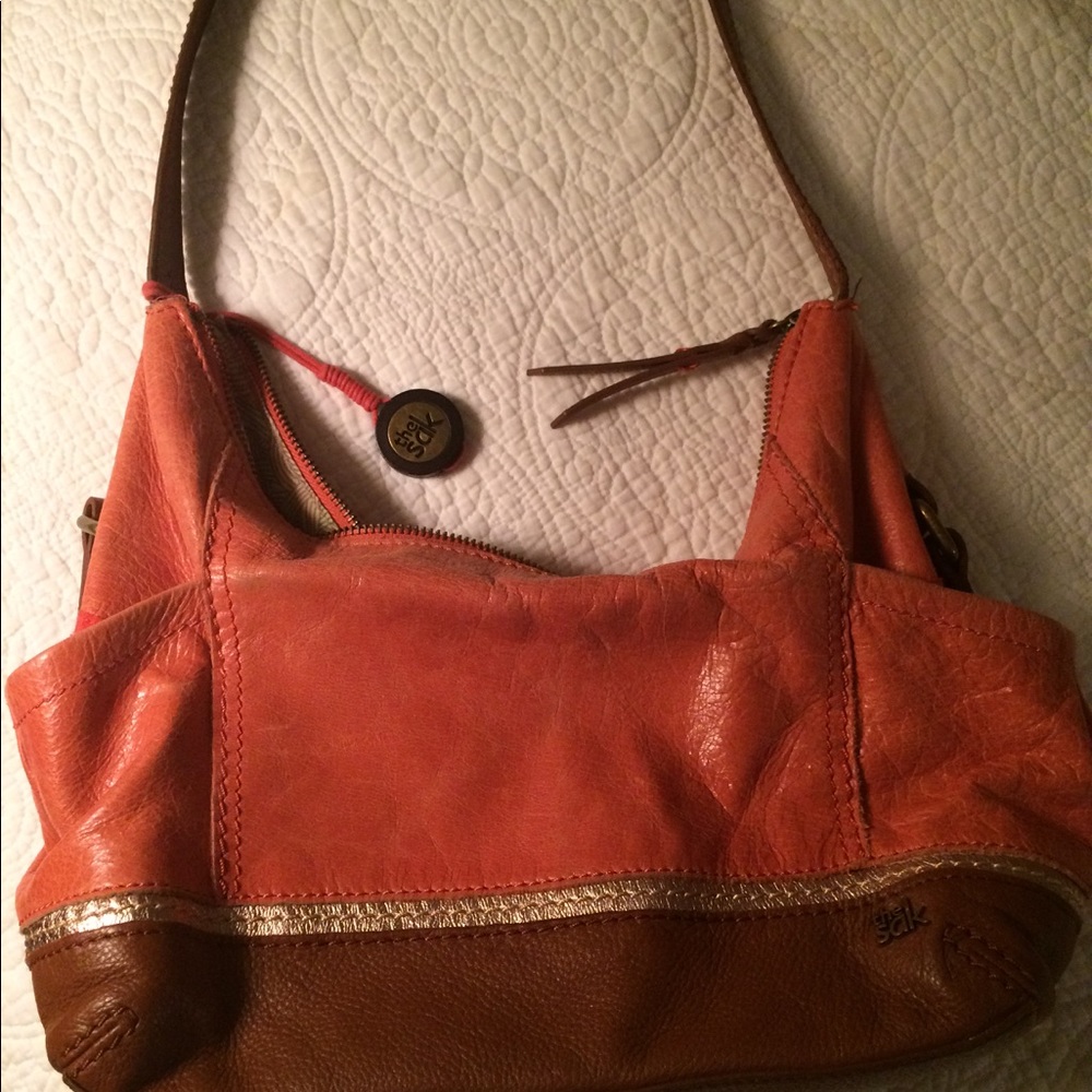 👜The Sak  - orange and rust leather handbag.
