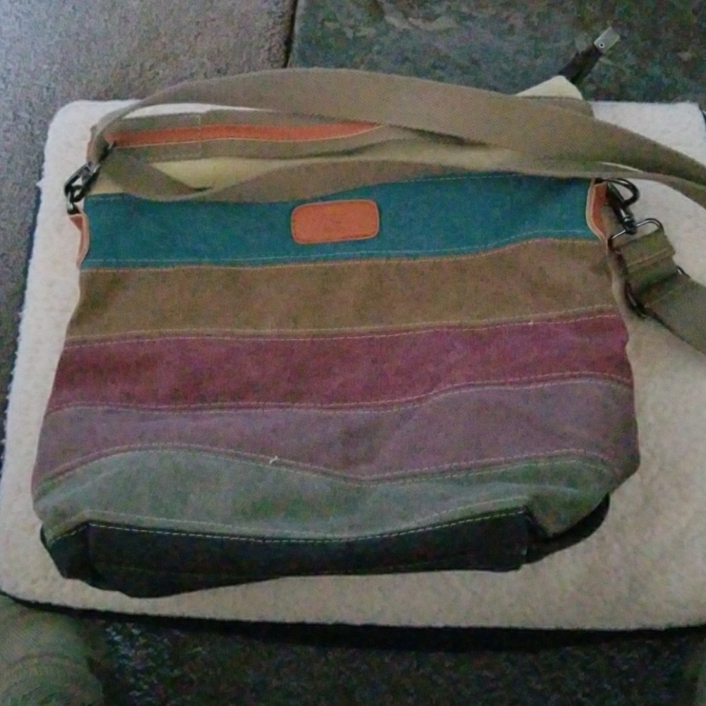 Purse with built in handles, along with long strap