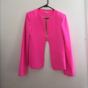Hot pink statement blazer . With gold zippers.